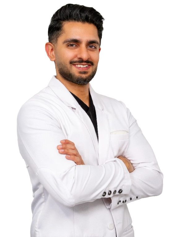 VTC_DrMehta_Coat_665x765_optimized Professional portrait of Dr. Walter Lech, a vein specialist, wearing a white lab coat and glasses, posed against a black background with arms crossed. This formal clinical headshot represents a healthcare provider specializing in vein treatment services.