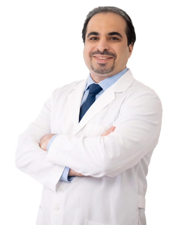 VTC_DrBasiri_Cutout_1_640x800_optimized Professional headshot of Dr. wearing a white lab coat, smiling at the camera against a black background. This is a standard medical professional portrait used for clinic or practice identification.